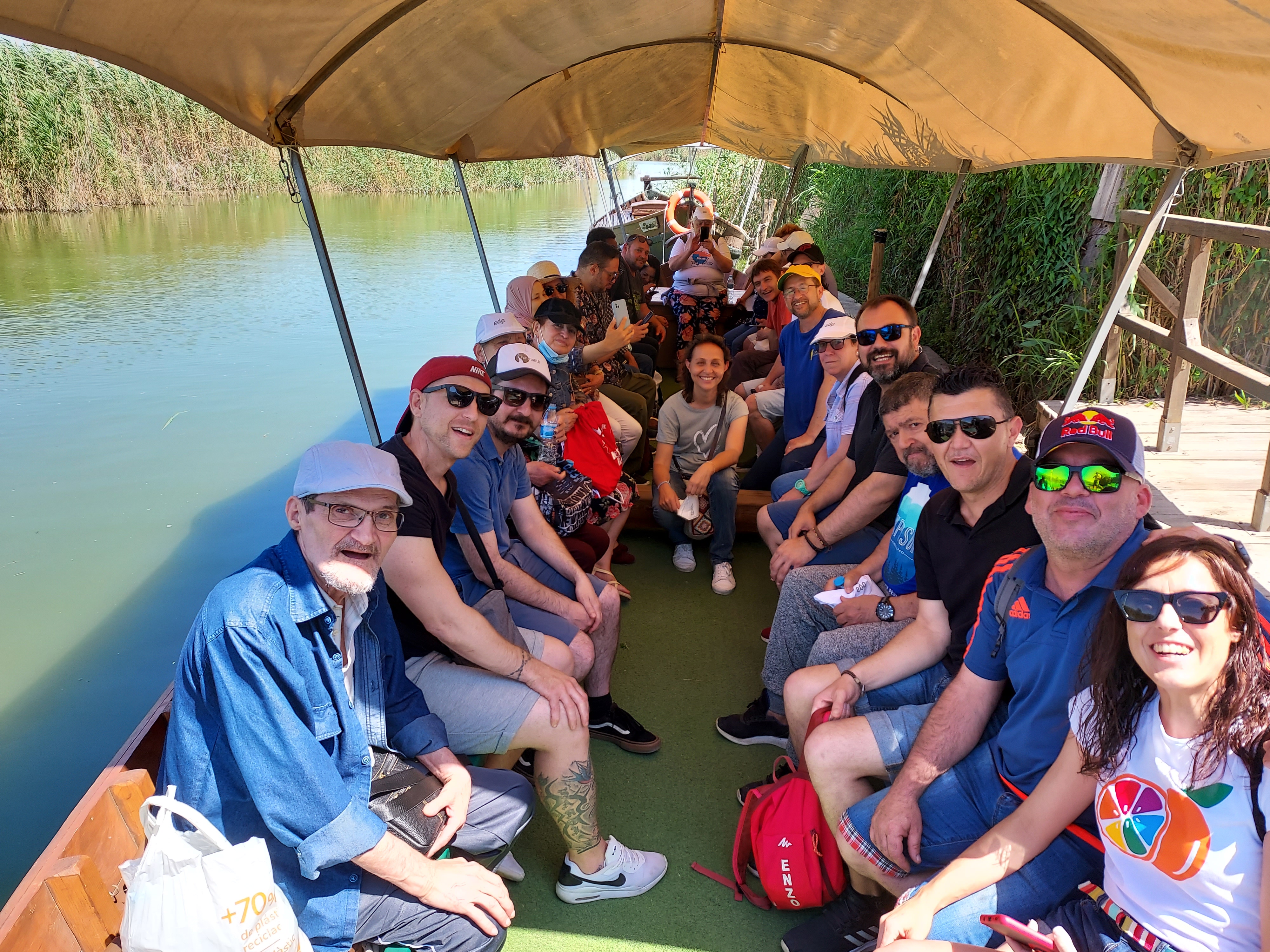 Givaudan volunteers together with beneficiaries of the project on a boat trip in a natural part