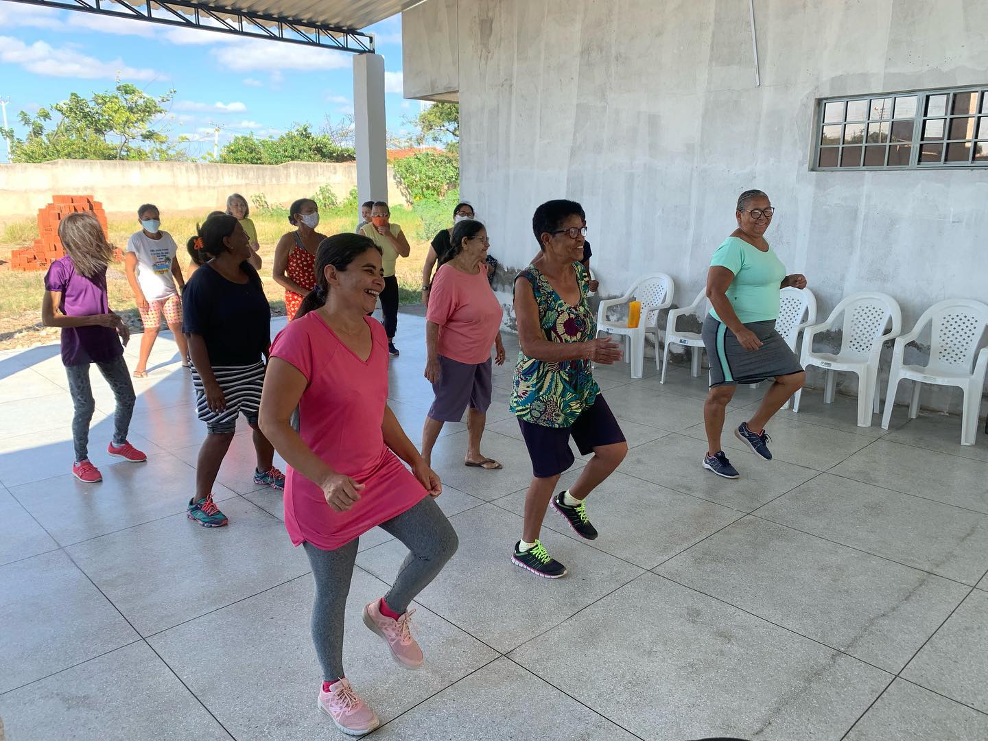 Older people happily taking part in a sport activity