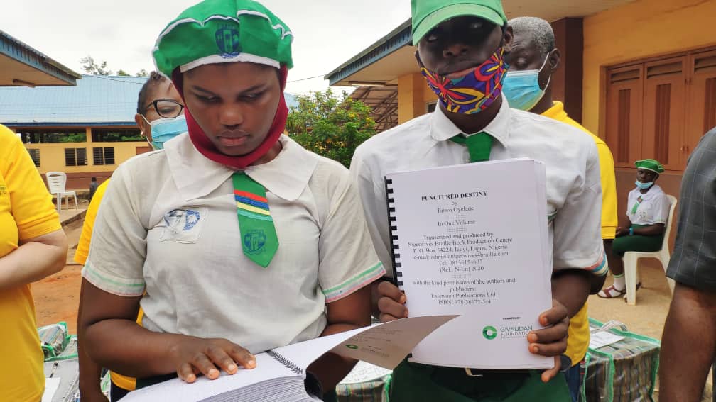 two students with Braill books