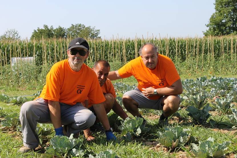 Three adults posing at Il Rastrello garden