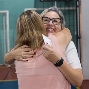 Givaudan volunteer and project participant hugging 